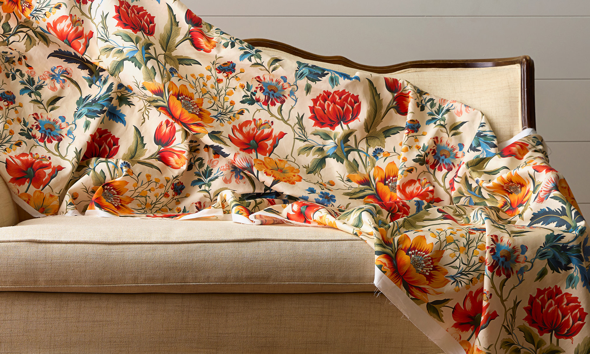 Wide upholstery fabric draped across a settee.