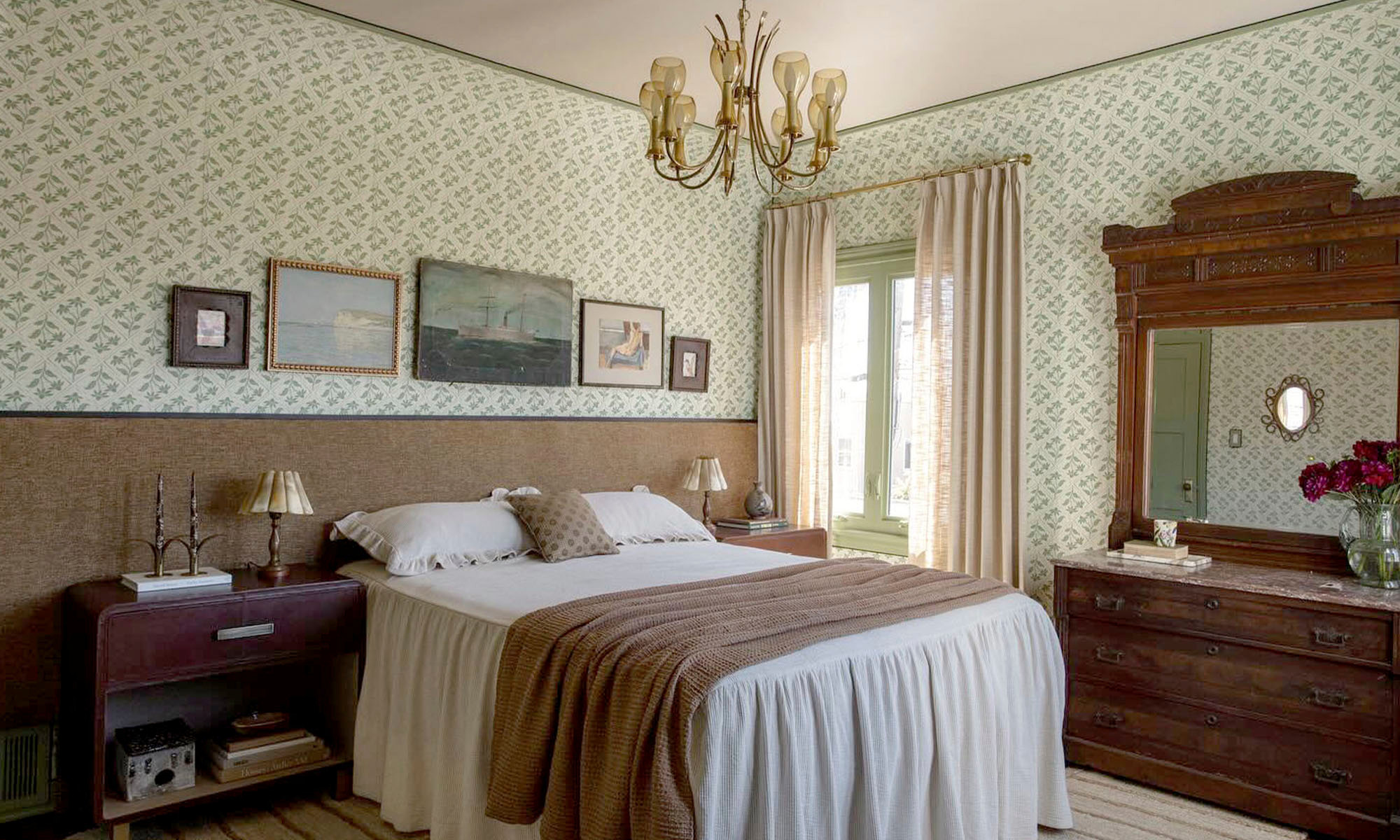 Guest bedroom with green block printed grasscloth wallpaper.