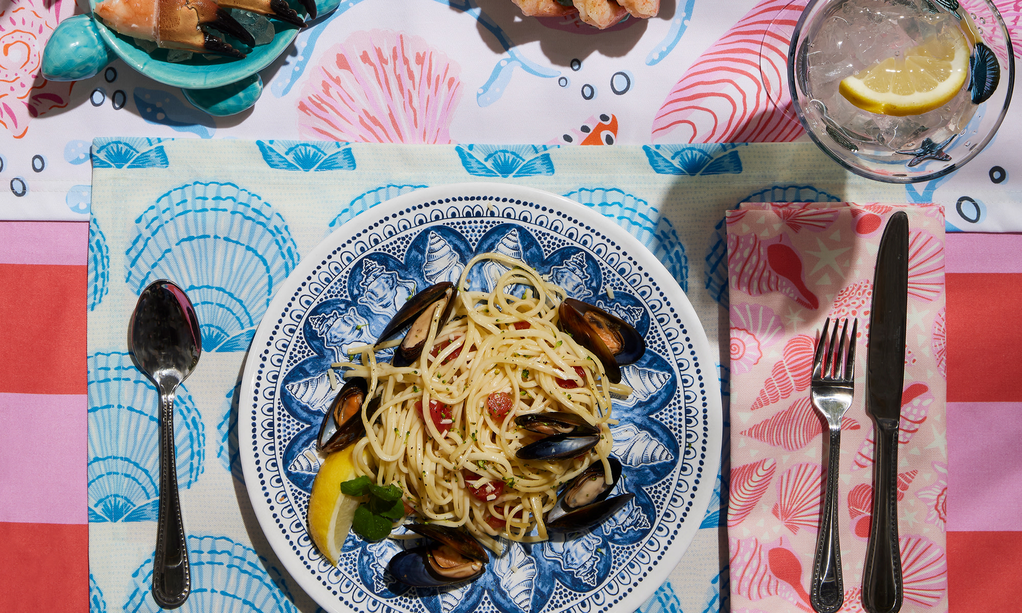 A colorful summer table setting with coastal designs