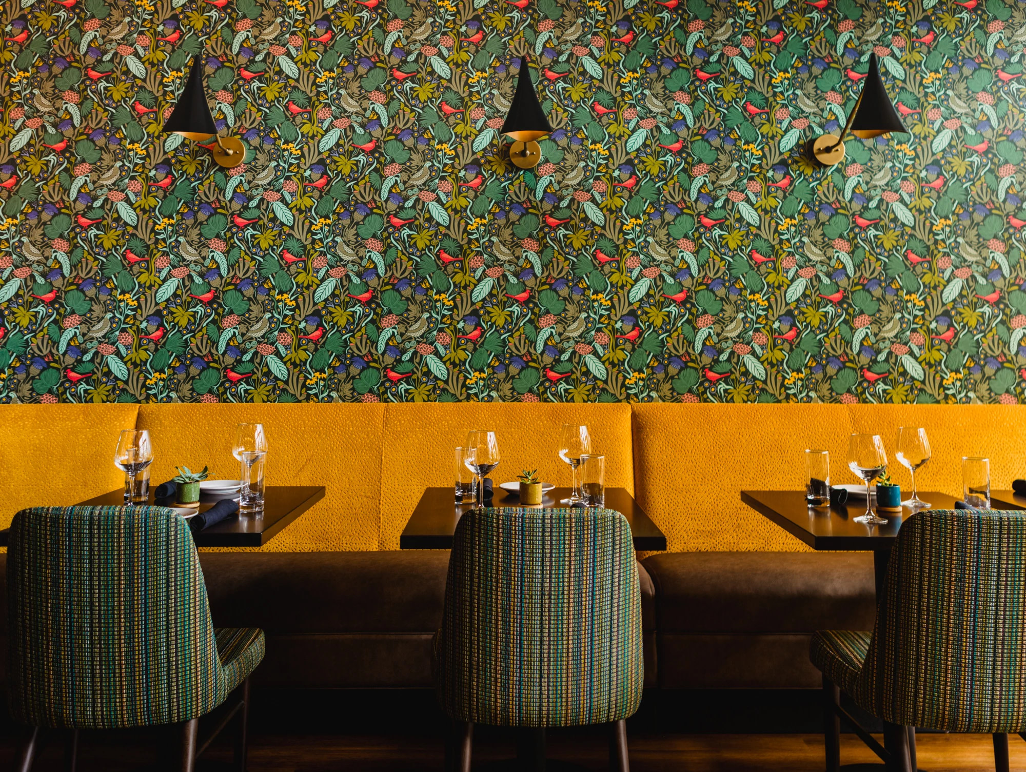 Wallpaper behind a booth in a hotel restaurant