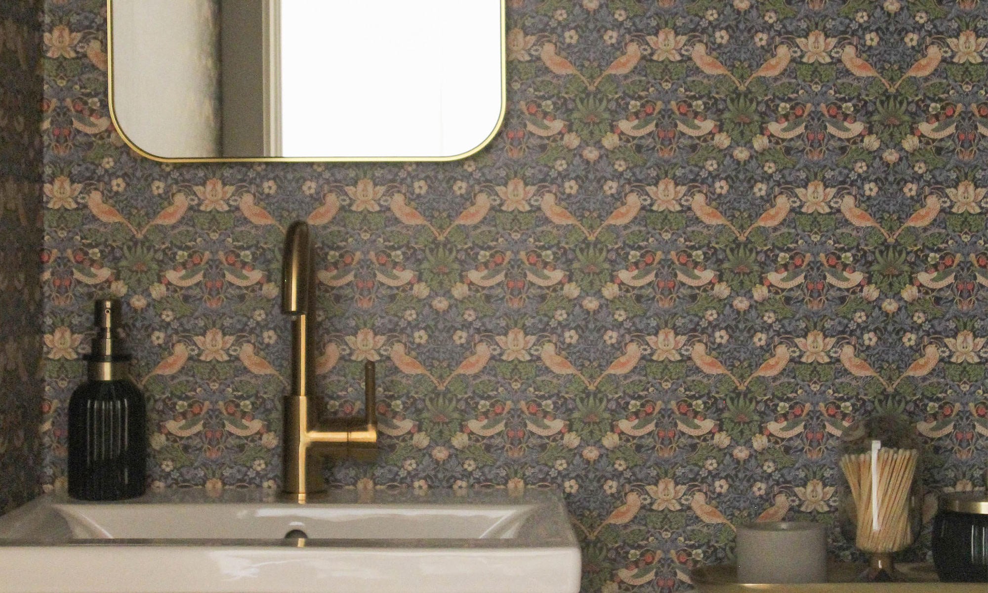 Bathroom with William Morris inspired non-pasted wallpaper.